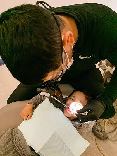 Dentist caring for an emergency dental patient